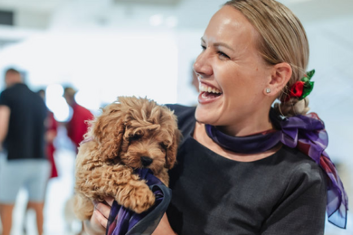 Therapy dog with Brisbane Airport staff